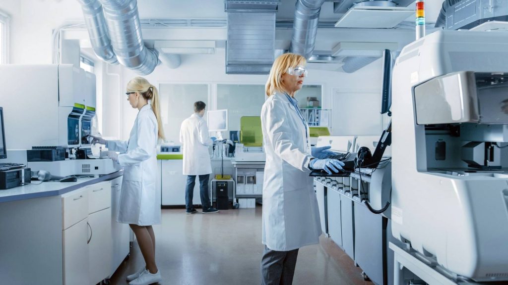 Two female and male research scientist working in a laboratory