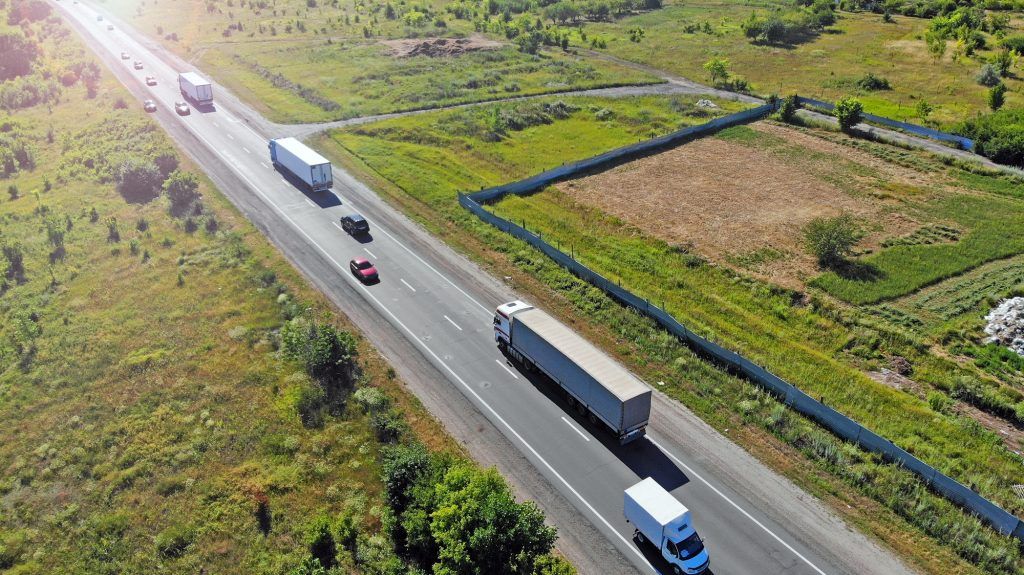 A bird's eye view of the road with smart cars and trucks
