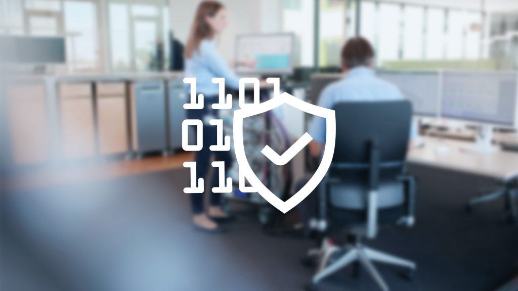 Two ITK engineers in front of screens are working on test strategies and automated tests for a verification and validation project.