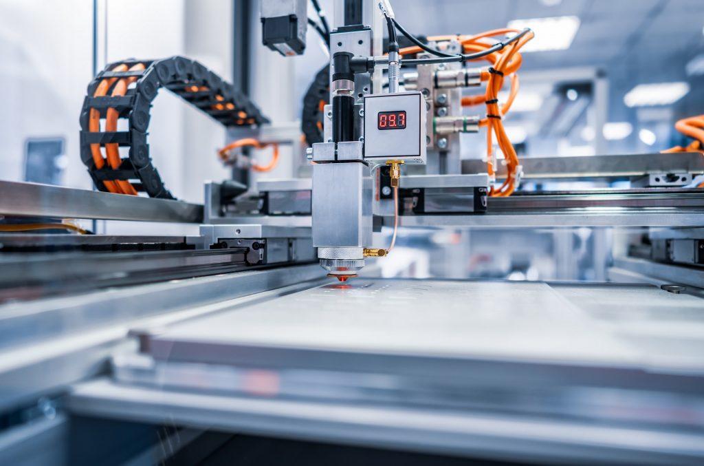 Modern Industrial Technology: CNC laser cutting of metal.