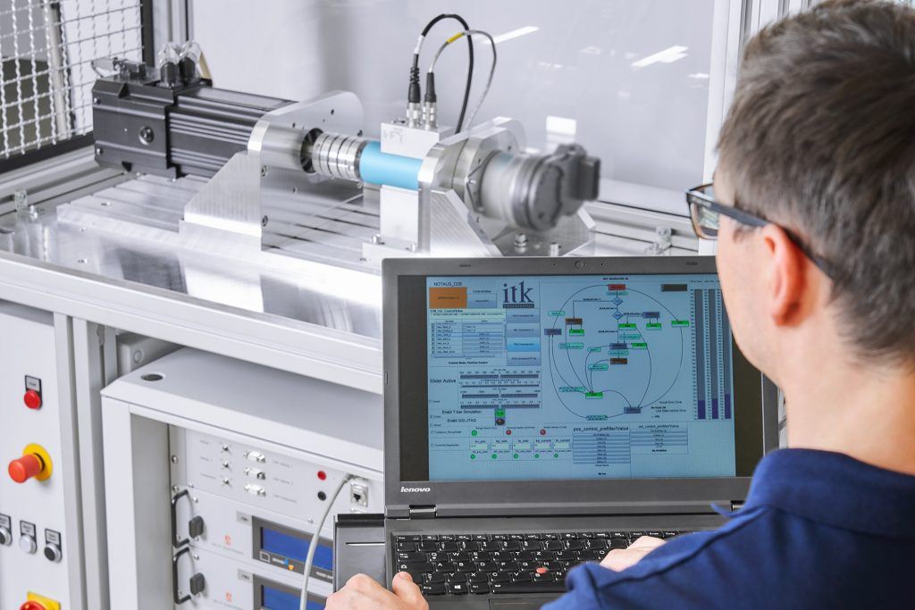 Engineer testing powerpacks at a testbench