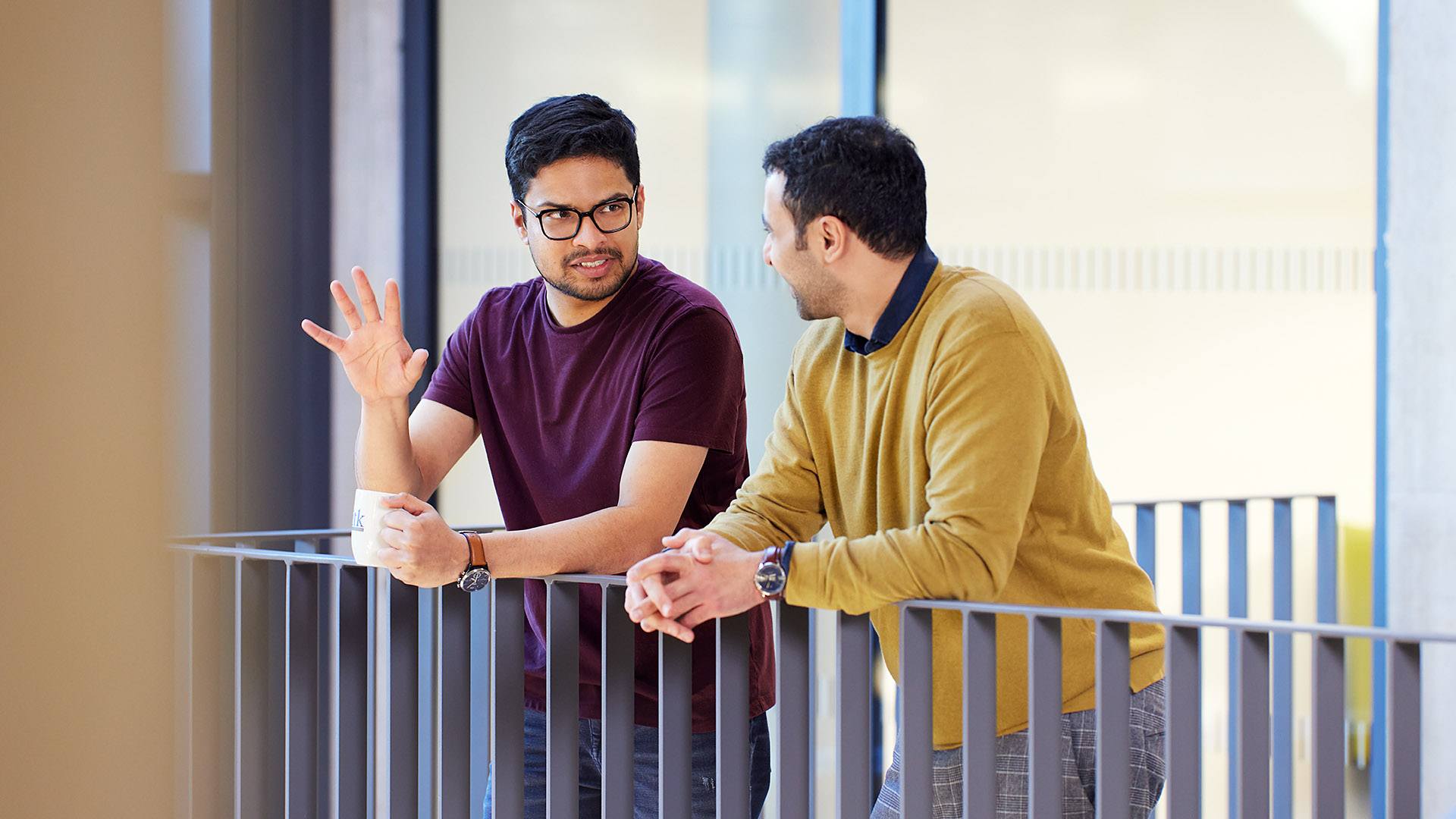 Two experienced ITK employees having an excited conversation