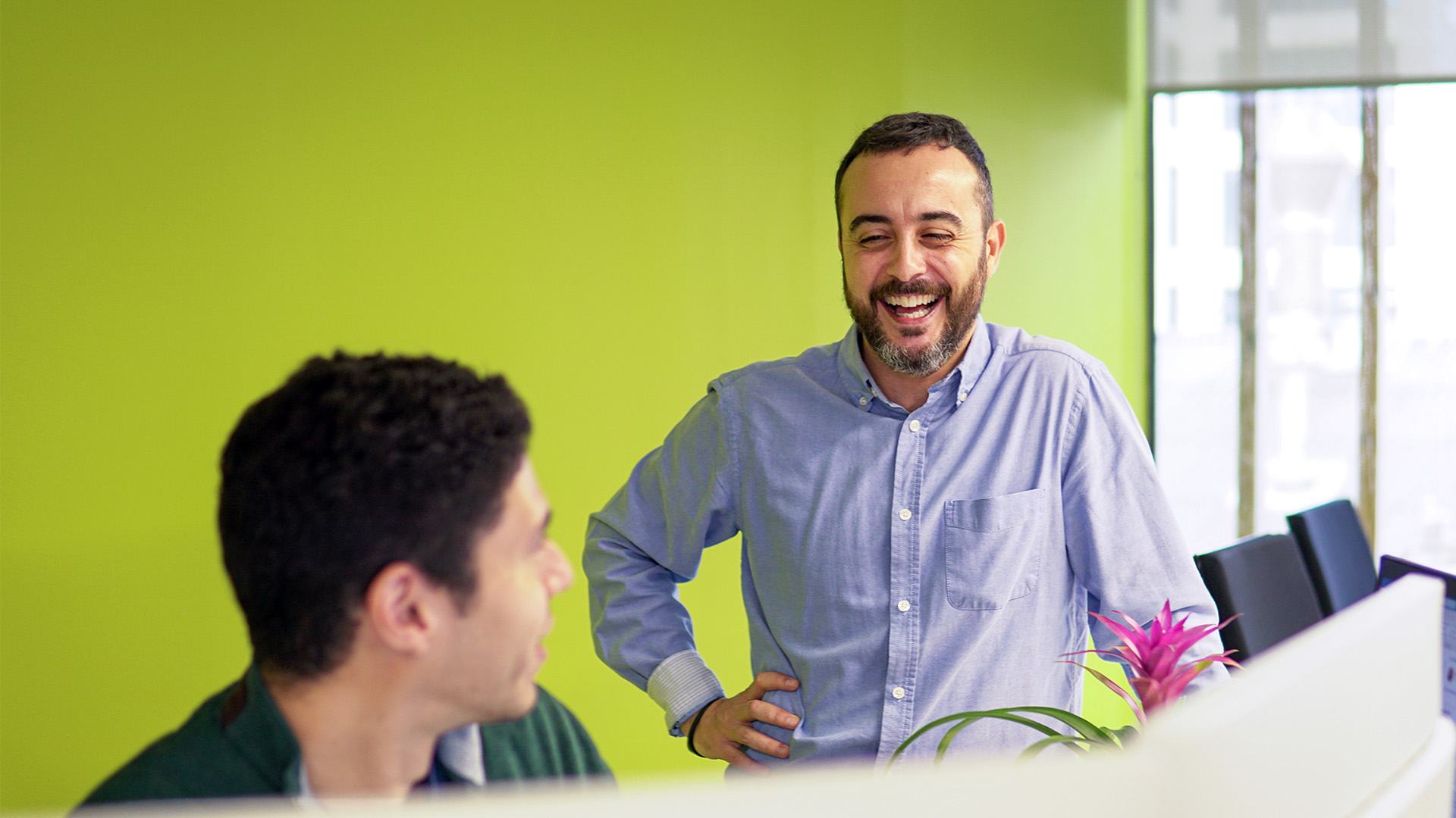 José in conversation with a colleague 
