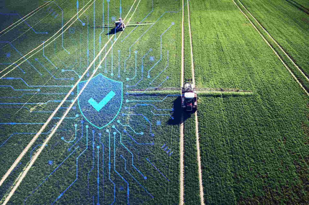 Tractor in a field with functional safety symbol