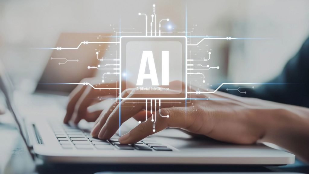 Training participant on a laptop during an AI training session.