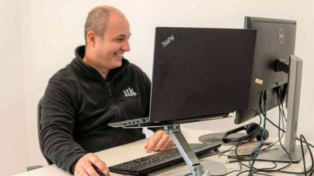 ITK Spain employee at his laptop